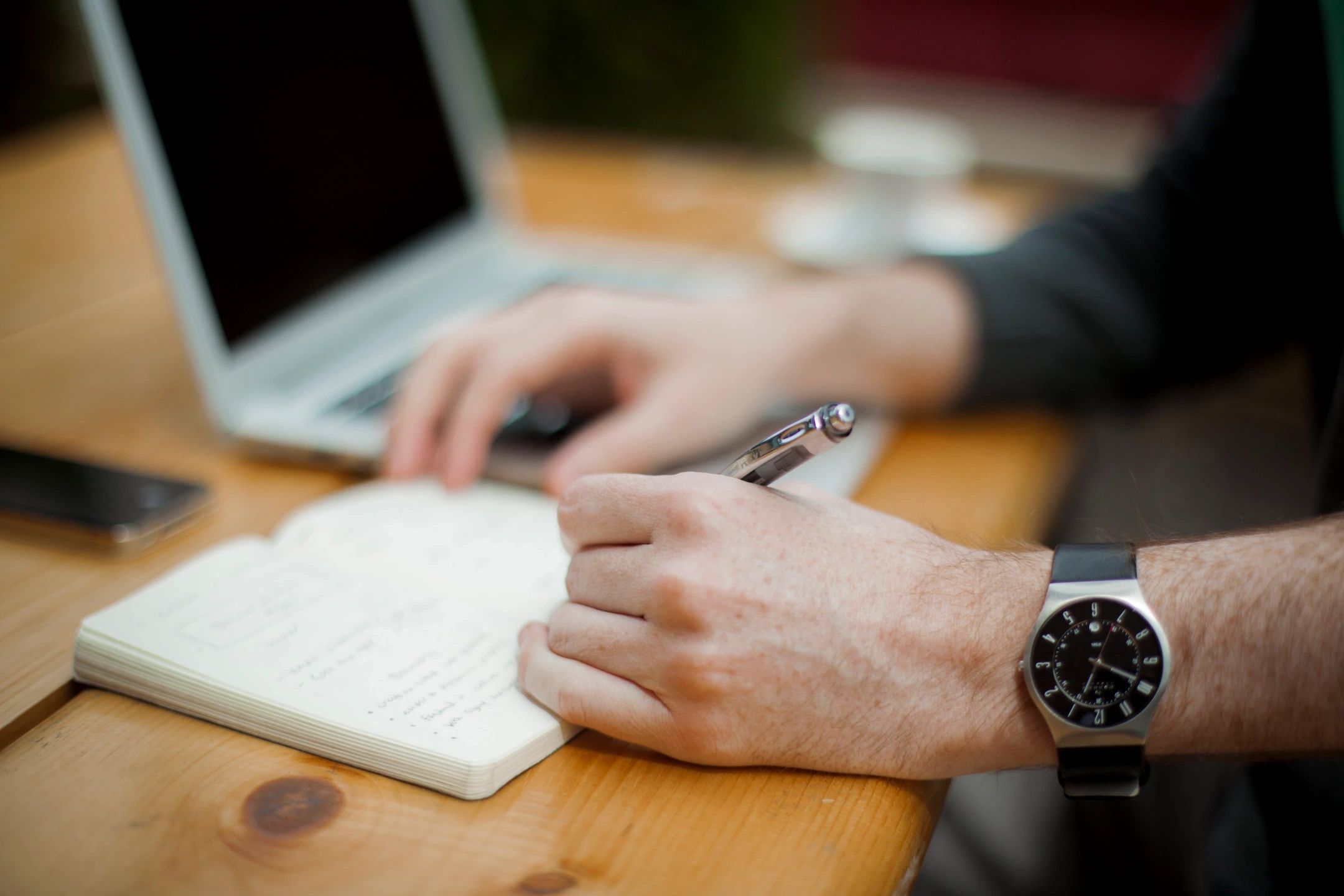 Business owner reviewing documentation at a desk, representing HR decision-making around redundancy